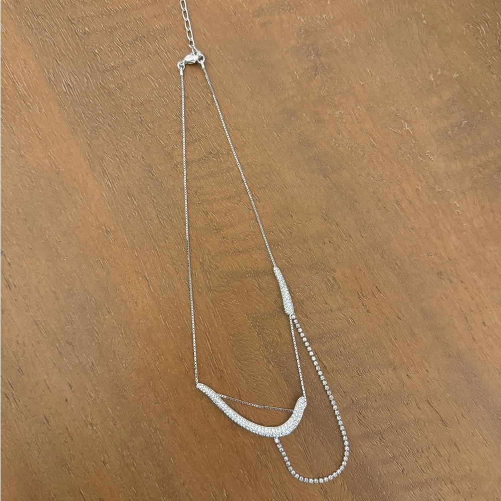 Swarovski rare and unique bow and arrow necklace.